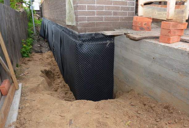Happy homeowners after waterproofing job in Trinity